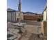 Backyard features a shed, gravel area, wooden fence, and black patio furniture at 10951 N 91St Ave # 255, Peoria, AZ 85345