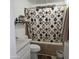 Well-organized bathroom featuring bathtub with shower and curtain, sink and toilet at 10951 N 91St Ave # 255, Peoria, AZ 85345