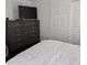 Bedroom featuring a large dresser, big closet and a comfortable bed at 10951 N 91St Ave # 255, Peoria, AZ 85345
