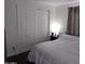Bedroom with large closet and side tables featuring lamps for evening reading at 10951 N 91St Ave # 255, Peoria, AZ 85345