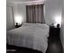 Cozy bedroom featuring neutral paint, side tables and patterned curtains at 10951 N 91St Ave # 255, Peoria, AZ 85345
