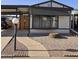 Cozy home featuring a carport, walkway, and low maintenance desert landscaping at 10951 N 91St Ave # 255, Peoria, AZ 85345