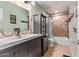 Bathroom featuring decorative tile backsplash and tub with shower showcasing artistic touches at 12375 W Meadowbrook Ave, Avondale, AZ 85392