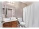 Bathroom with wooden vanity and shower providing a clean and functional space at 12375 W Meadowbrook Ave, Avondale, AZ 85392