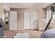Bedroom with dual closets and a view from the window providing natural light and storage at 12375 W Meadowbrook Ave, Avondale, AZ 85392