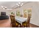 Dining room features hardwood floors and ample light, perfect for Gathering gatherings at 12375 W Meadowbrook Ave, Avondale, AZ 85392