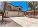 Attractive two-story home showcasing a wide driveway and a neatly maintained front yard at 12375 W Meadowbrook Ave, Avondale, AZ 85392