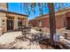 Welcoming front patio furnished with comfortable seating and adorned with charming decor at 12375 W Meadowbrook Ave, Avondale, AZ 85392