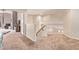 Upstairs hallway with carpet, a handrail, and doors leading to other rooms at 12375 W Meadowbrook Ave, Avondale, AZ 85392