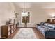 Comfortable living room showcases hardwood floors, a large window, and stylish furnishings at 12375 W Meadowbrook Ave, Avondale, AZ 85392