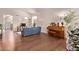 Open-concept living space boasts hardwood floors and seamless flow to other areas at 12375 W Meadowbrook Ave, Avondale, AZ 85392