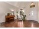 Bright living room featuring hardwood floors and a large window with natural light at 12375 W Meadowbrook Ave, Avondale, AZ 85392