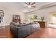 Relaxing living room area with hardwood floors, a comfortable couch, and natural light at 12375 W Meadowbrook Ave, Avondale, AZ 85392