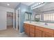 Bathroom features double sinks, walk in shower, and separate toilet room at 13630 W Redfield Rd, Surprise, AZ 85379
