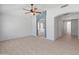 Bright and airy bedroom with large window, neutral paint, and tile flooring at 13630 W Redfield Rd, Surprise, AZ 85379