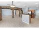 Open-concept space featuring brick columns and archways connects living, dining, and kitchen areas at 13630 W Redfield Rd, Surprise, AZ 85379