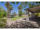 Beautiful backyard with lush landscaping, grass area, playground, and covered patio at 15828 N 10Th Pl, Phoenix, AZ 85022