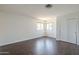Well-lit bedroom with wood flooring and a large closet, providing comfort and functionality at 15828 N 10Th Pl, Phoenix, AZ 85022