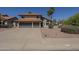 Inviting two-story home with a gray two-car garage, red tile roof, and well-maintained front yard at 15828 N 10Th Pl, Phoenix, AZ 85022