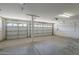 Spacious three-car garage with concrete floors, providing ample parking and storage space at 15828 N 10Th Pl, Phoenix, AZ 85022
