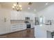 Modern kitchen featuring white cabinetry, stainless steel appliances, and a stylish backsplash at 15828 N 10Th Pl, Phoenix, AZ 85022