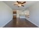 Upstairs living room featuring hardwood floors, a built-in cabinet, and a half-wall railing at 15828 N 10Th Pl, Phoenix, AZ 85022