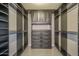 Spacious walk-in closet featuring built-in shelving, drawers, and rods for organizing your wardrobe at 15828 N 10Th Pl, Phoenix, AZ 85022