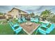 Beautiful backyard with a fire pit surrounded by chairs, a pool, and a covered gazebo area at 16197 N 157Th Ave, Surprise, AZ 85374