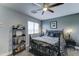 Stylish bedroom with decorative wrought iron bed frame, modern light fixtures, and comfortable decor at 16197 N 157Th Ave, Surprise, AZ 85374
