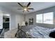 Tastefully decorated bedroom with a comfortable bed, a cozy reading chair and serene decor at 16197 N 157Th Ave, Surprise, AZ 85374