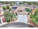 Beautiful two-story home featuring a well-manicured lawn, desert landscaping, and a wide driveway leading to a spacious three-car garage at 16197 N 157Th Ave, Surprise, AZ 85374