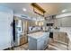 Contemporary kitchen features sleek cabinetry, stainless steel appliances, and an island, creating a functional and stylish space at 16197 N 157Th Ave, Surprise, AZ 85374