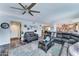 Spacious living room with an open layout featuring comfortable seating and wood-look flooring at 16197 N 157Th Ave, Surprise, AZ 85374