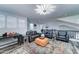 Spacious living area with modern decor, including stylish seating, whiteboards, and a vibrant patterned rug at 16197 N 157Th Ave, Surprise, AZ 85374