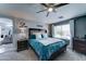 Comfortable bedroom with a large bed, ceiling fan, and view of the neighborhood at 16197 N 157Th Ave, Surprise, AZ 85374