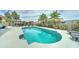 Captivating backyard featuring a sparkling blue pool, a covered gazebo, and swaying palm trees at 16197 N 157Th Ave, Surprise, AZ 85374