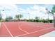 Community outdoor basketball court with fencing, lighting, and benches for a fun recreation space at 1659 N Channing --, Mesa, AZ 85207