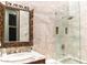 This bright bathroom features a stylish sink and a glass door shower at 1659 N Channing --, Mesa, AZ 85207