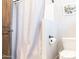 Bathroom featuring a toilet and a shower behind a shower curtain at 1659 N Channing --, Mesa, AZ 85207