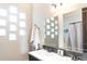 Well-lit bathroom with a unique window design and double sink at 1659 N Channing --, Mesa, AZ 85207