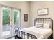 This bedroom features neutral colors and a black metal frame bed at 1659 N Channing --, Mesa, AZ 85207