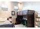 This charming bedroom features a bunk bed with a built-in desk and a twin bed at 1659 N Channing --, Mesa, AZ 85207