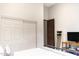 This bedroom features an interior door, a closet, and a television at 1659 N Channing --, Mesa, AZ 85207