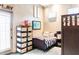 Cozy bedroom with natural light, dark wood furnishings and a full size bed at 1659 N Channing --, Mesa, AZ 85207