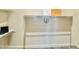 Bright, walk-in closet with white shelving and hangers at 1659 N Channing --, Mesa, AZ 85207