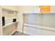 Bright, walk-in closet with white shelving, hangers, and shopping bags at 1659 N Channing --, Mesa, AZ 85207
