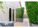 Inviting courtyard featuring a side door and attractive landscaping for a private outdoor space at 1659 N Channing --, Mesa, AZ 85207
