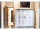 Bright hallway featuring storage closet, views to another room and dark wood accents at 1659 N Channing --, Mesa, AZ 85207