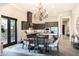 Bright, open kitchen and dining area featuring modern appliances, stylish lighting, and outdoor access at 1659 N Channing --, Mesa, AZ 85207