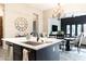 Modern kitchen island features stainless steel appliances, sink, and a stylish design that complements the home's aesthetic at 1659 N Channing --, Mesa, AZ 85207